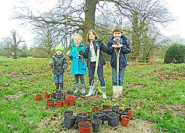 Children with pots of saplings