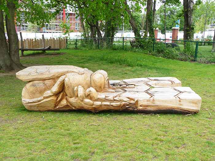 seat carved in the shame of a bee